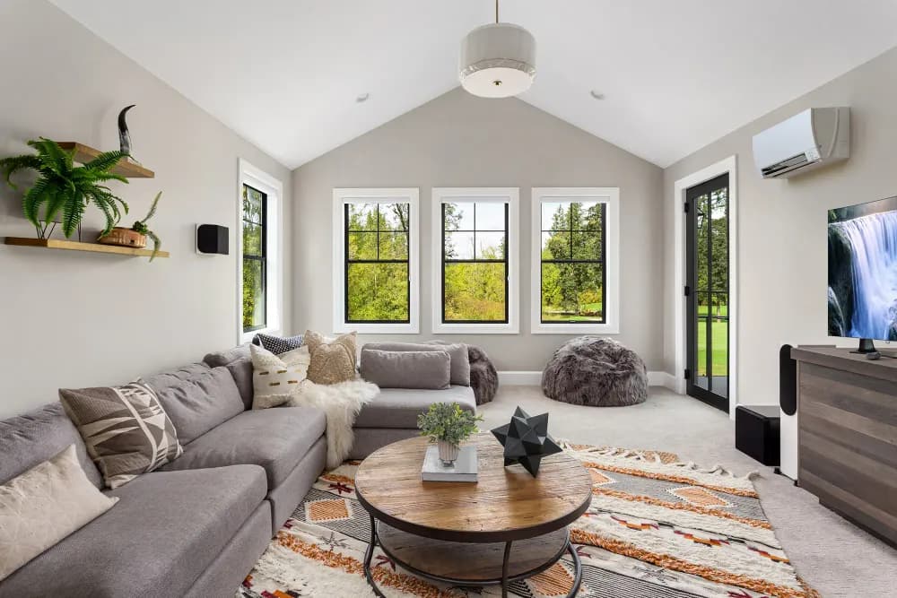Comfortable living room with a ductless mini-split unit installed — Ondus Heating & Air Conditioning